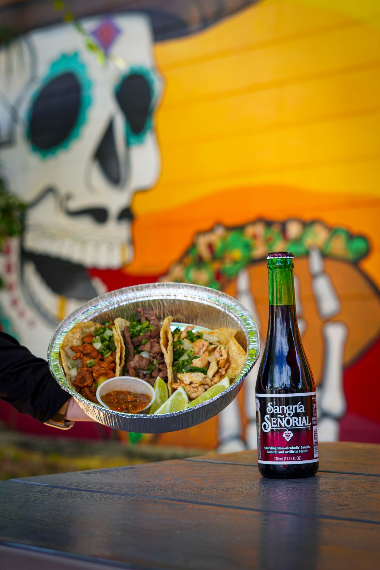 El Indio tacos and Sangría Señorial El Indio tacos served with a bottle of Sangría Señorial soda at the 13th Street location